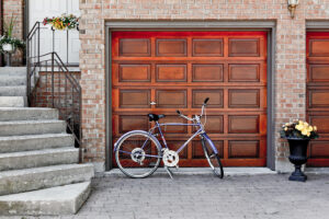 wooden garage door with a bike parked in front of it