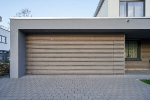 Emergency Garage Door Opener . Carriage House Garage Doors in two tone color.