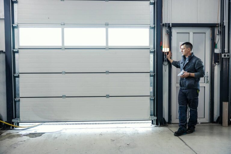 Person operating a garage door control.
