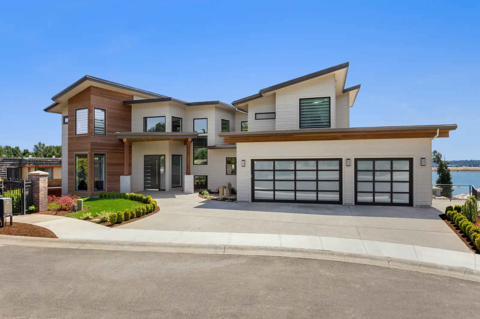 An auto mechanic is opening a garage door at a mechanic's workshop for a professional Garage Door Installation.