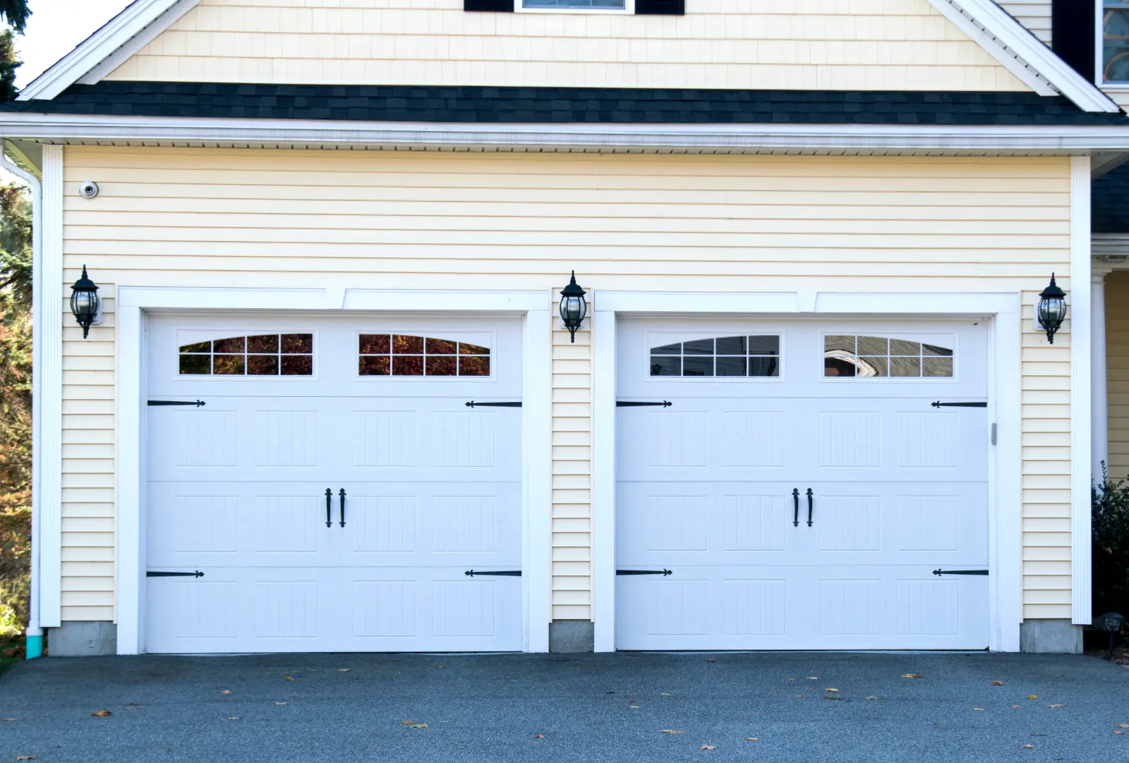 Proficient Garage Door at a typical single house painted in light blue color.