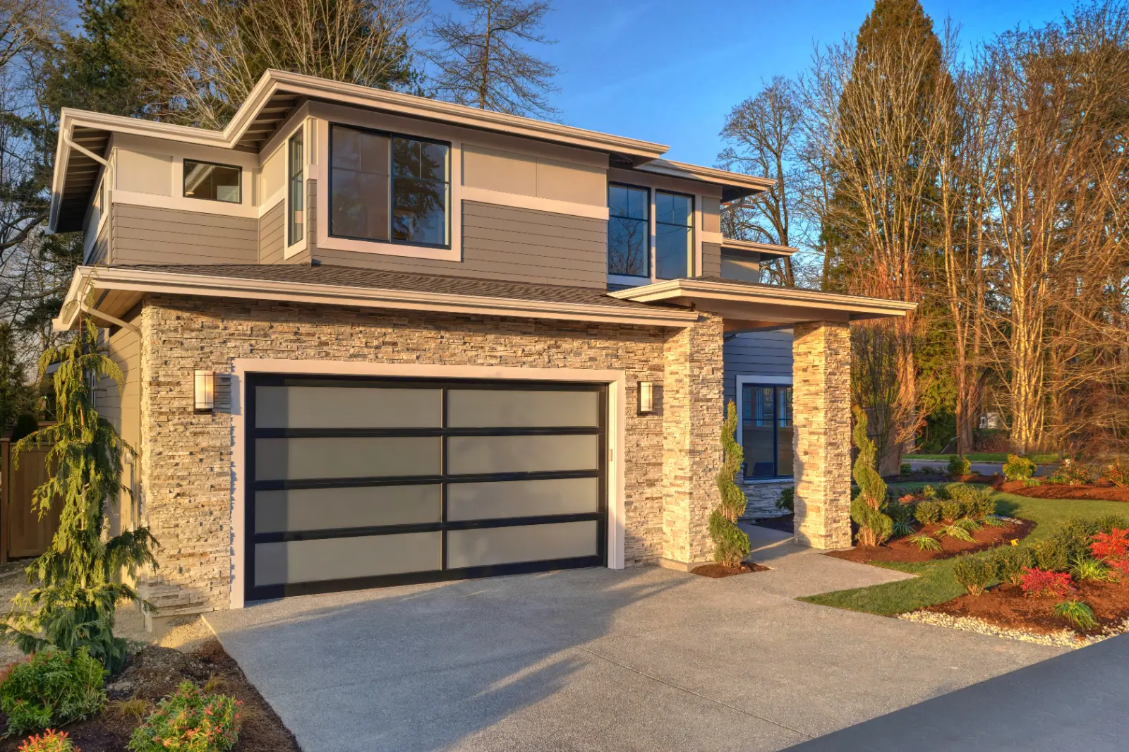 Modern contemporary house exterior with luxury details. Elevate curb appeal by Choosing Garage Door Installation Services for superior quality and style.