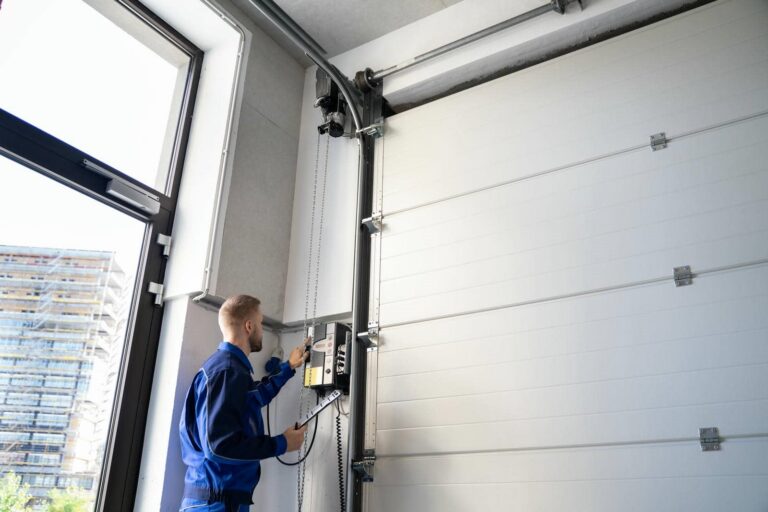 Person operating a garage door opener.