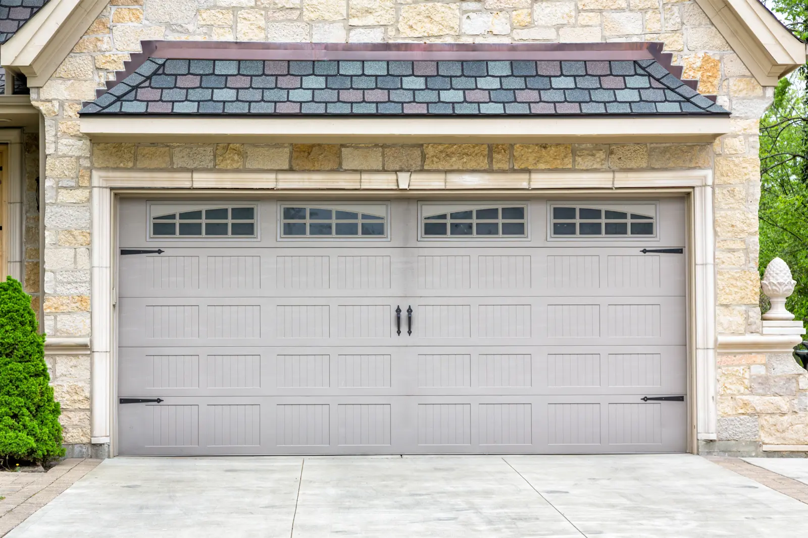 Traditional two-car garage, an excellent choice among our top-rated garage door options. Enhance your home's appeal with quality craftsmanship and style.