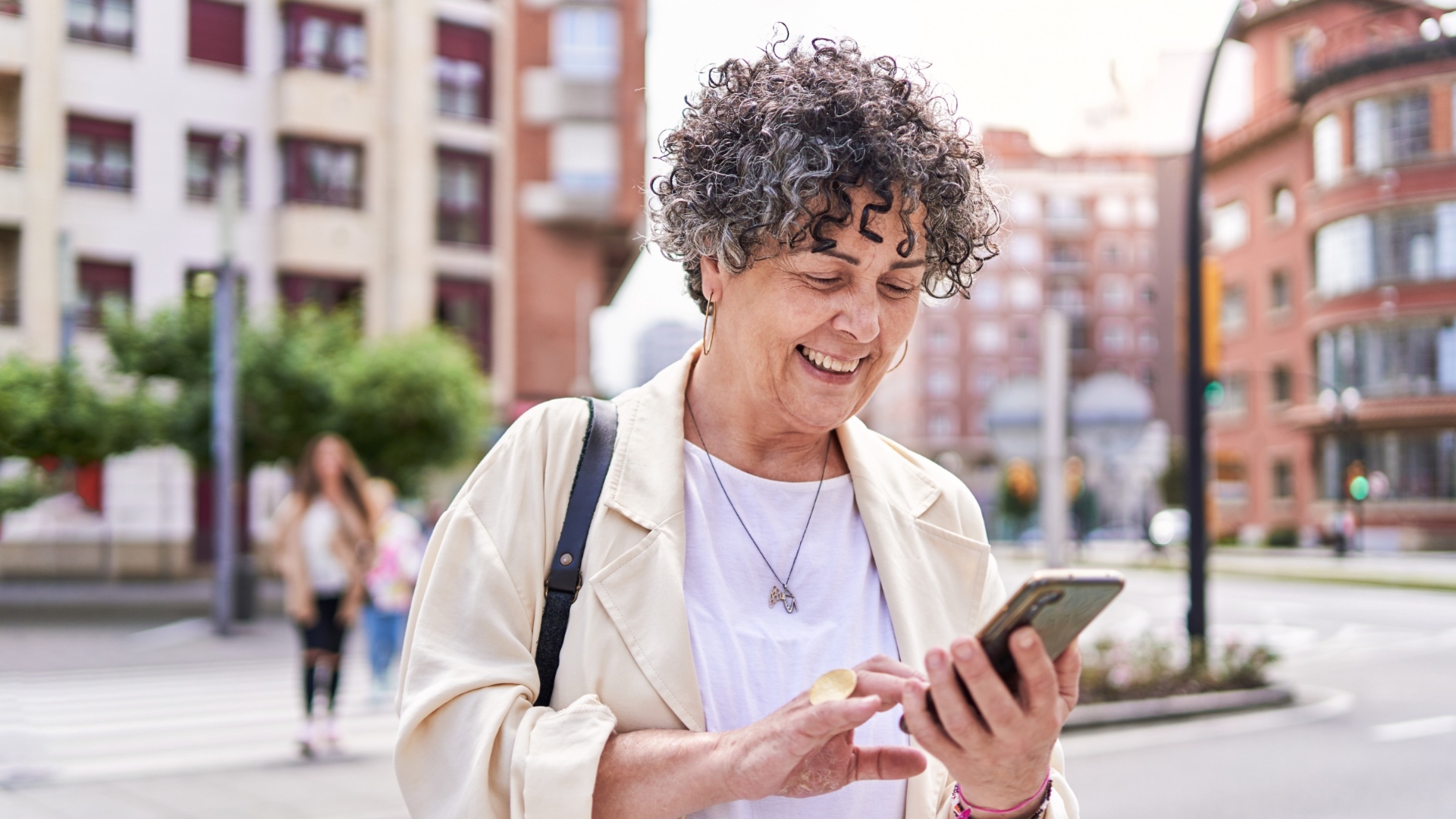 Mature woman holding a cell phone