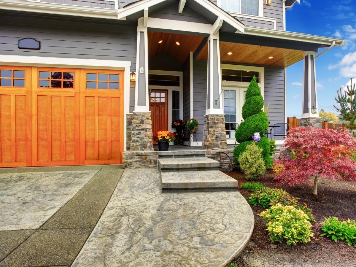 The R Value of a garage door measures its insulation. A New home as shown will have higher R value doors.