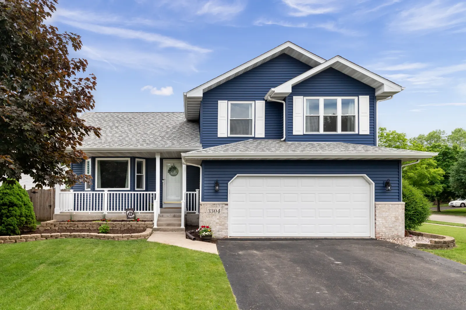 blue and gray house with New Style Garage Doors