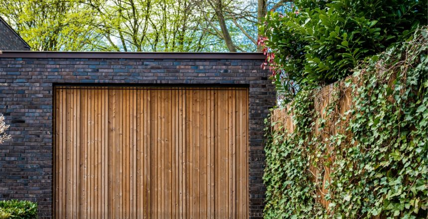 Modern garage door design ideas, like planked wood (shown) are par for the course in 2023.