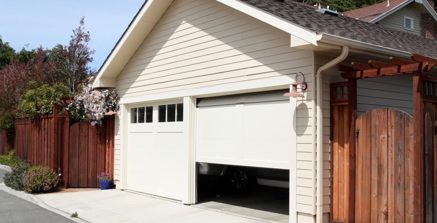 home with garage doors that has one door randomly opening