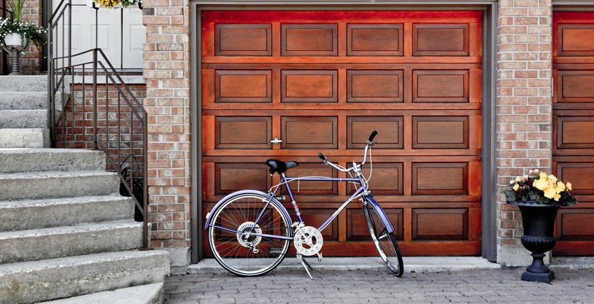 wooden garage door with a bike parked in front of it