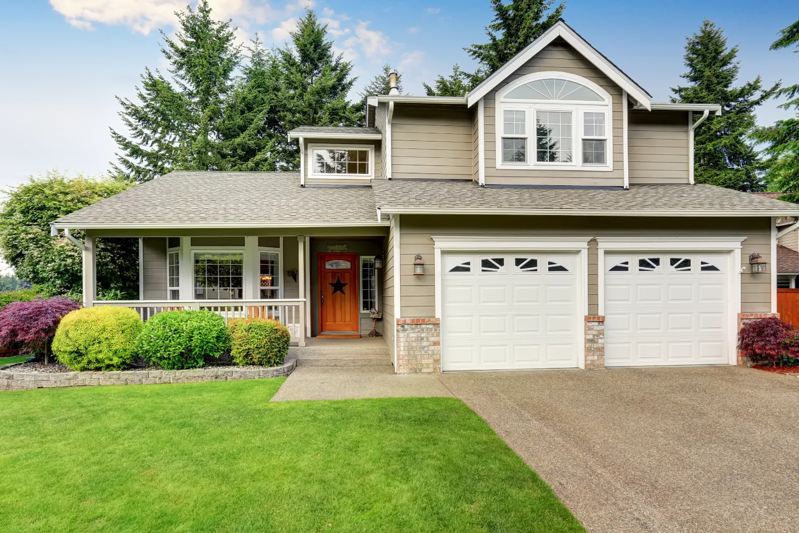 Exterior view of a family home with a double garage - Best Garage Door Models