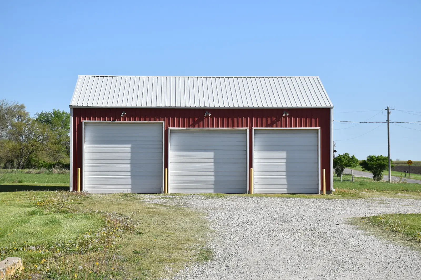 Three-stall garage with insights on New Garage Door Cost - discover the perfect addition for your home.