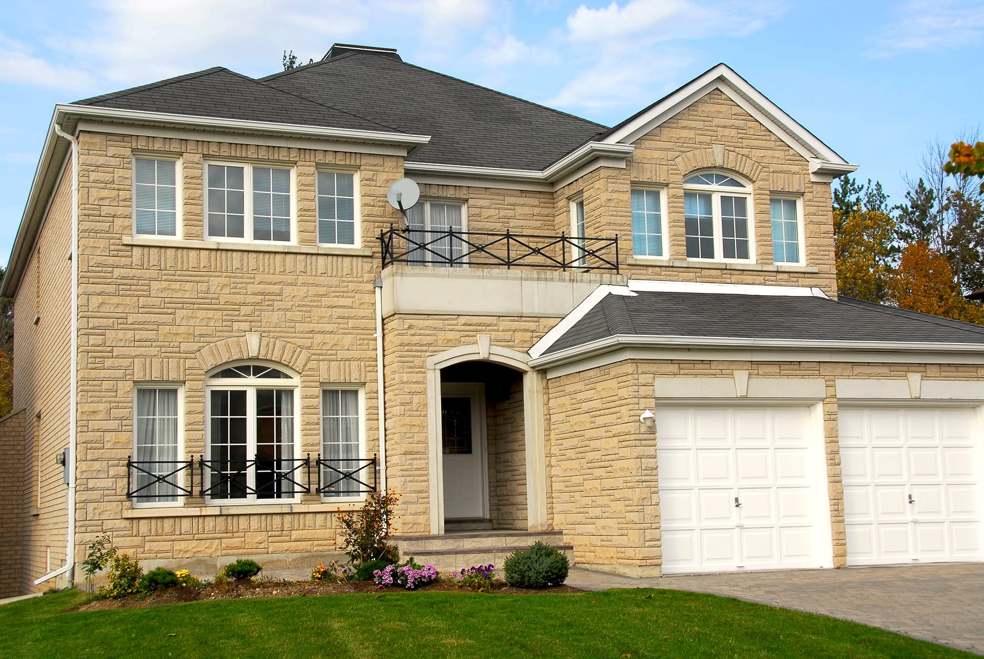 Garage door width is an issue when deciding between a single 'double door' or two single doors.